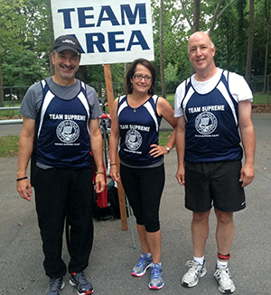 Photo of Justice David, Justice Rush, and Justice Massa at a triathlon event