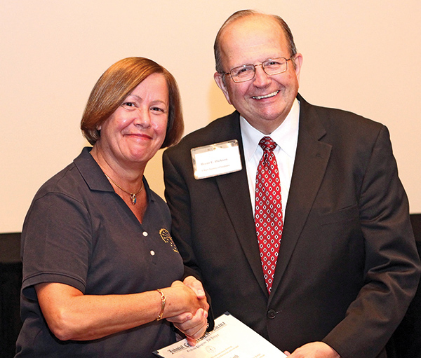 Judge Gail Bardach of Hamilton County shakes hands with then-Chief Justice Brent Dickson and receives a Judicial College Certificate September 2012.