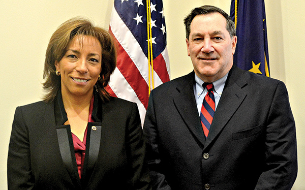 Floyd County Judge Maria Granger stands to the right of Senator Joe Donnelly.