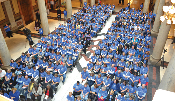 Hundreds of CASA volunteers fill the North Atrium of the State House
