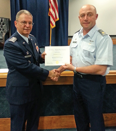 Major Robert Freese receiving his Certificate of Completion from Maj Gen Vazquez, National Commander, Civil Air Patrol, at the National Staff College, Maxwell Air Force Base.