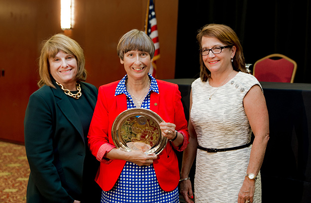 Senior Judge Barbara Harcourt stands with NCSC President Mary Campbell McQueen and Chief Justice Loretta Rush.