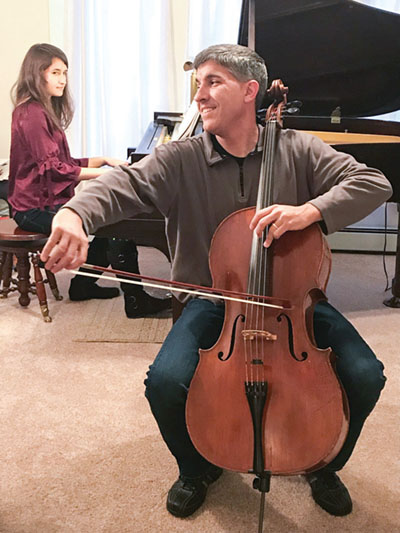 Judge Spahr and his daughter Anastasia practice their music.