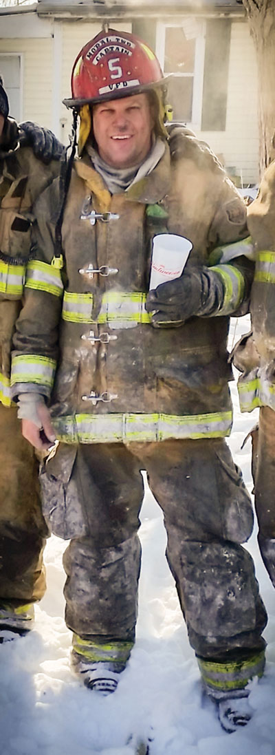 Judge David Riggins in full firefighter gear following a fire in Shelby County.