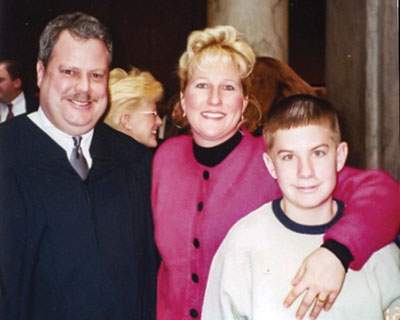 Judge Bill Nelson with his wife, Kristina, and stepson, Bryan.
