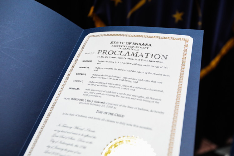 Signed proclamation in a blue folder.