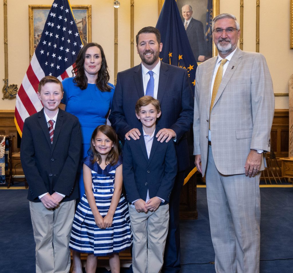 Judge Molter (center) and his family with Gov. Holcomb (right) following the public announcement of Molter's appointment.