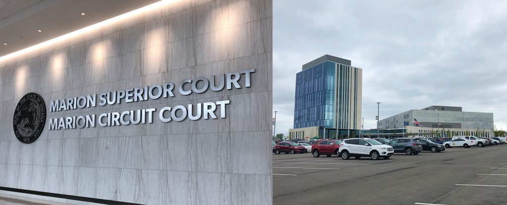 Outside view of the Marion County Community Justice Campus next to the Marion Superior Court and Marion Circuit Court sign.