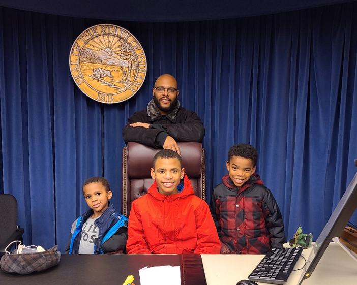 Judge Ryan Gardner with his children in a Marion County courtroom.