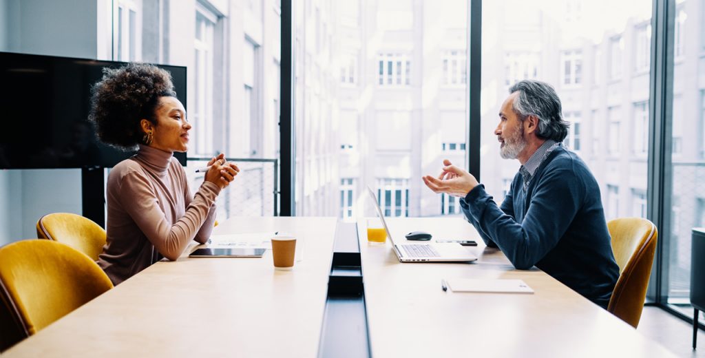 Two people meet for an open discussion.