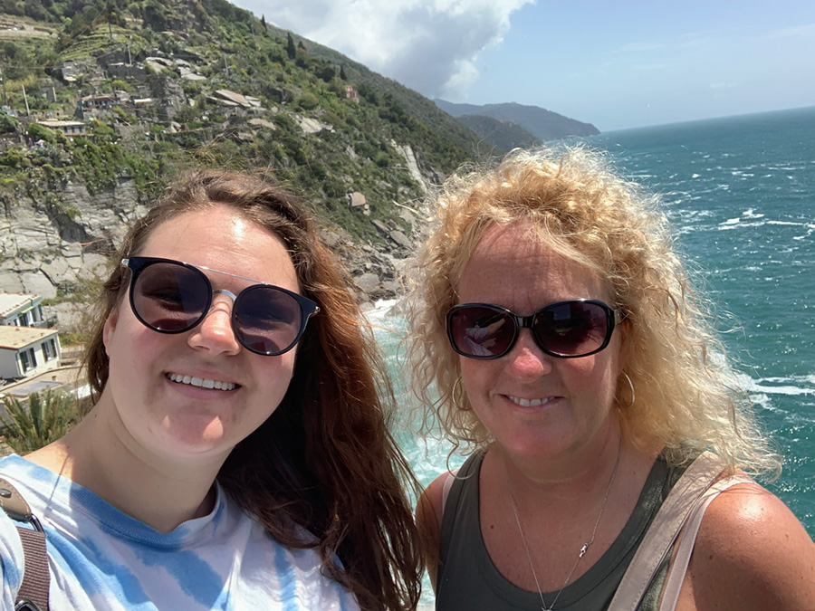 Judge Marla Clark and her daughter, wearing sunglasses, taking a selfie on the coast of Italy.