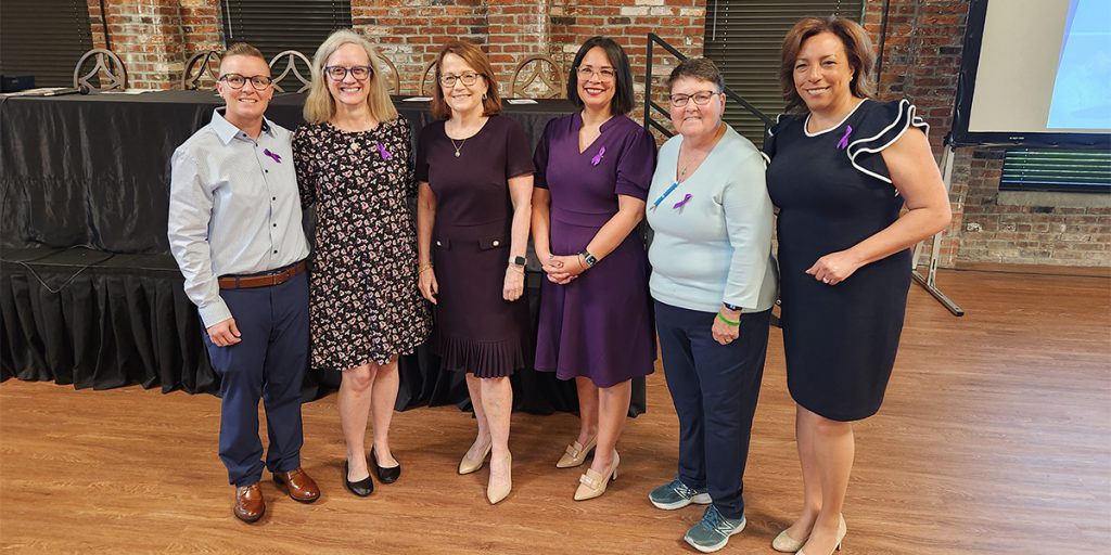 Photo of local judicial officers and stakeholders and Chief Justice Loretta Rush at the Problem-Solving Court Month celebration in Jeffersonville.