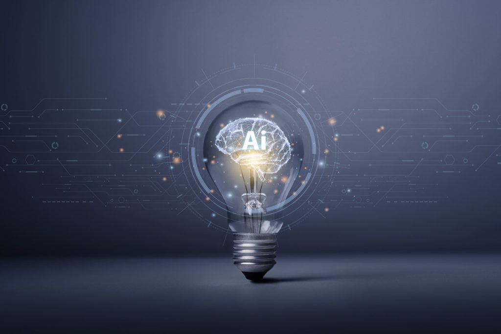 Abstract composition of a lightbulb powering a brain with the letters "AI" imprinted over it.