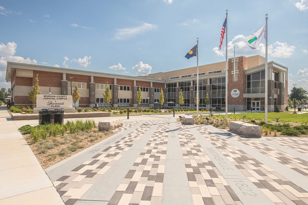A modern building with a plaza in front.
