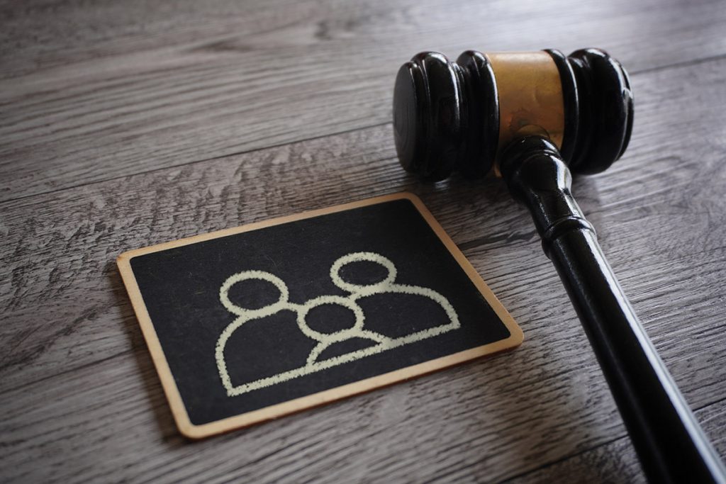 Closeup image judge gavel and chalkboard with family icon.